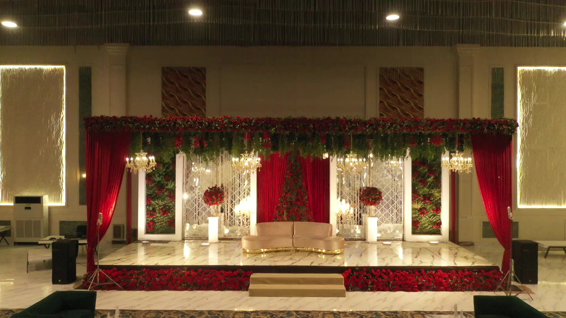 Wedding stage with floral backdrop and seating