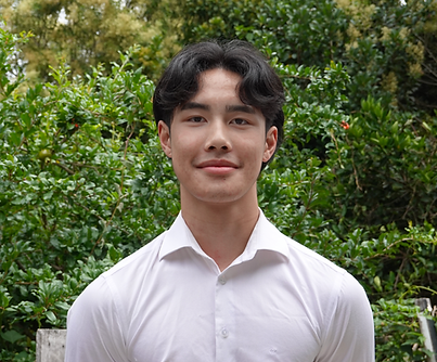 Angus outdoor headshot.png