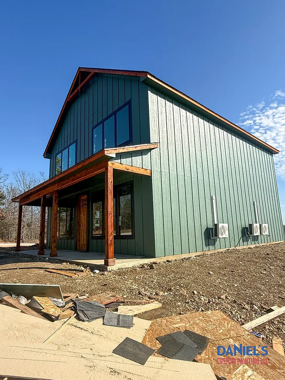 Green barn-style house exterior