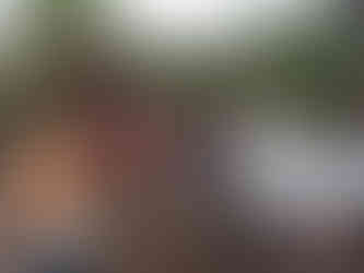 Community members receive roofing material for their homes.