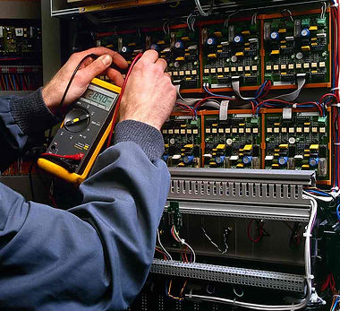 electrician-testing-industrial-machine-PW7XEXK.jpg