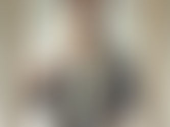 A small business owner holding a set of keys