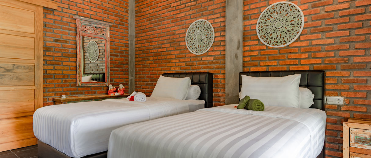 Twin beds in Alamanda Resort room