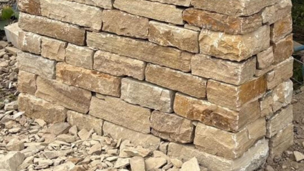 Hand-selected drystone walling stone with natural faces and stable shapes, laid without mortar for a traditional dry-built appearance.