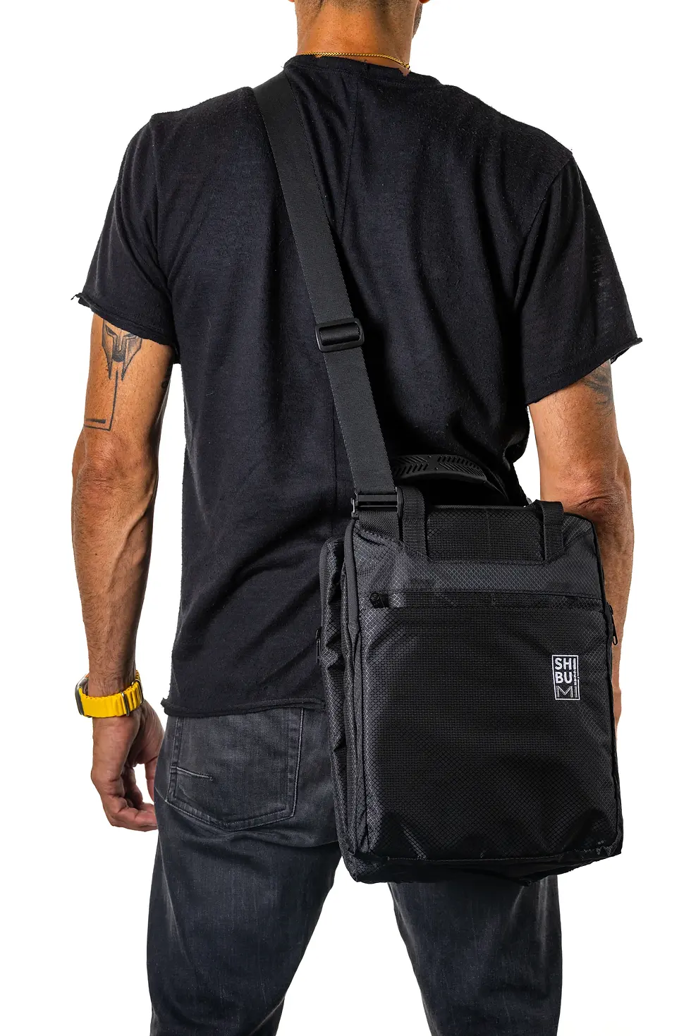 Man carrying a Shibumi Quick-Draw Side Strap bag from Shibumi Gear.