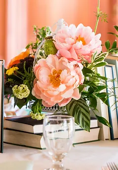 Coral Charm Peony Centerpiece Atop A Pile Of Book Krisztina Wesley VIEW PHOTOS Rustic Roots Design Logo Coral Charm Peony Centerpiece Atop A Pile Of Book Krisztina Wesley VIEW PHOTOS Rustic Roots Design Logo