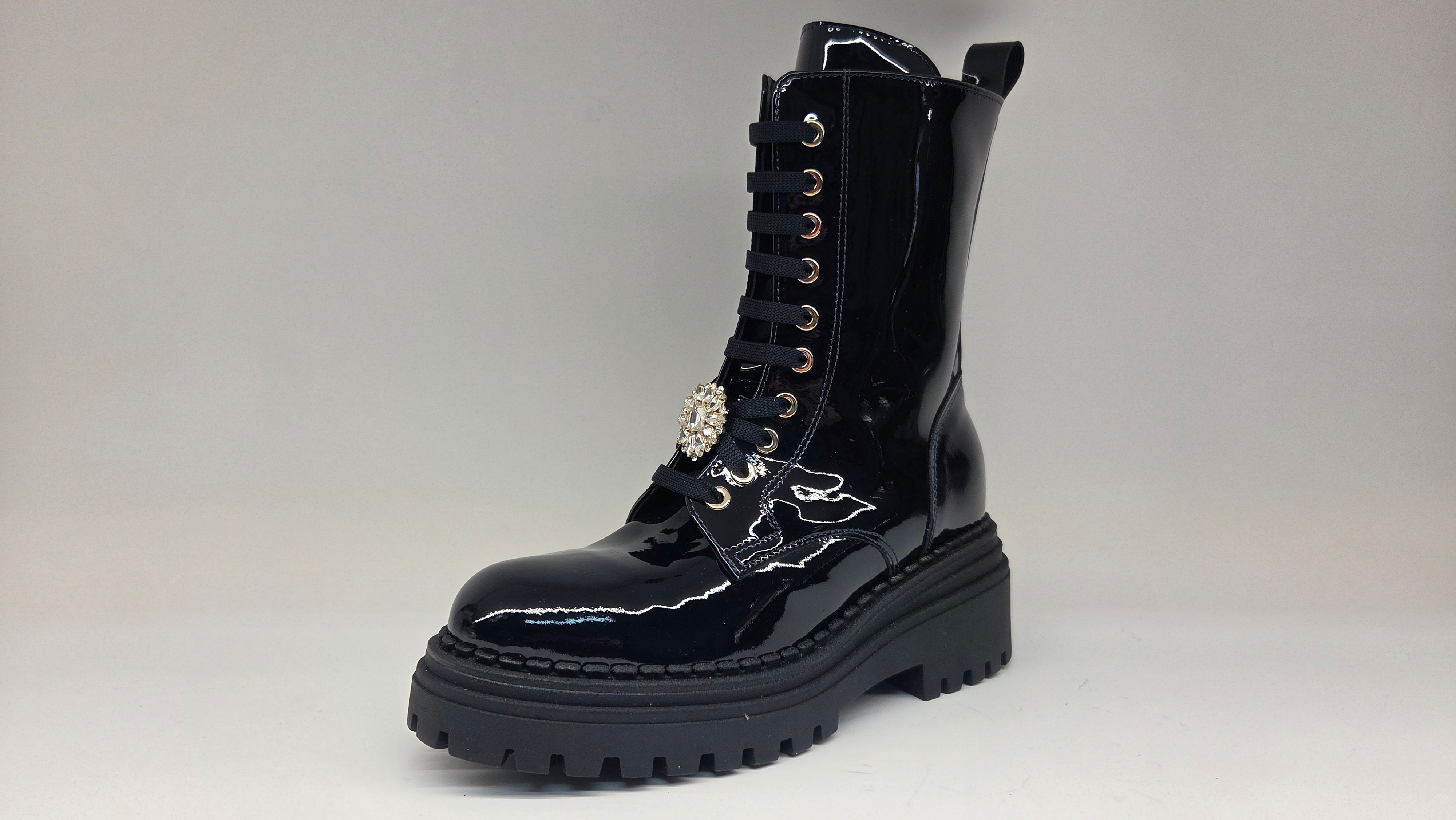 Anfibio in vernice blu notte e accessorio luminoso