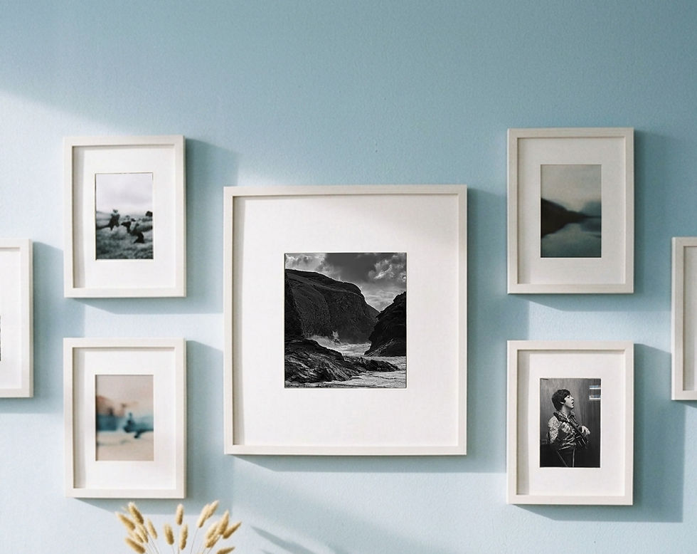 ART BY DESIGN gallery wall photo of matte white picture frames with black and white photography, custom framed by ART BY DESIGN in Los Angeles.