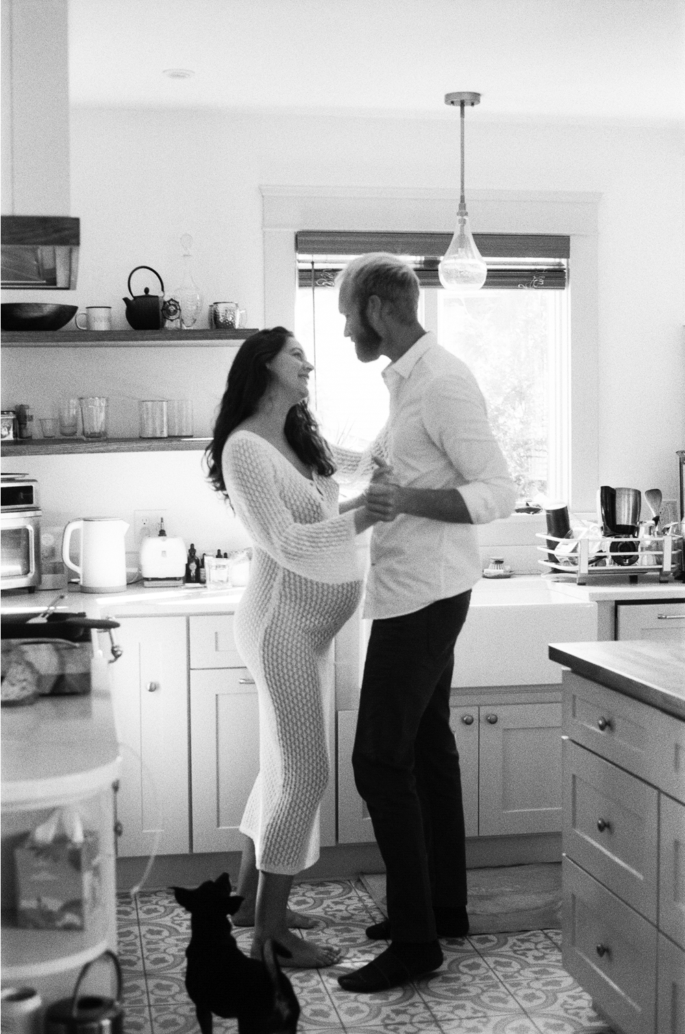 Film photography of a couple dancing in their kitchen