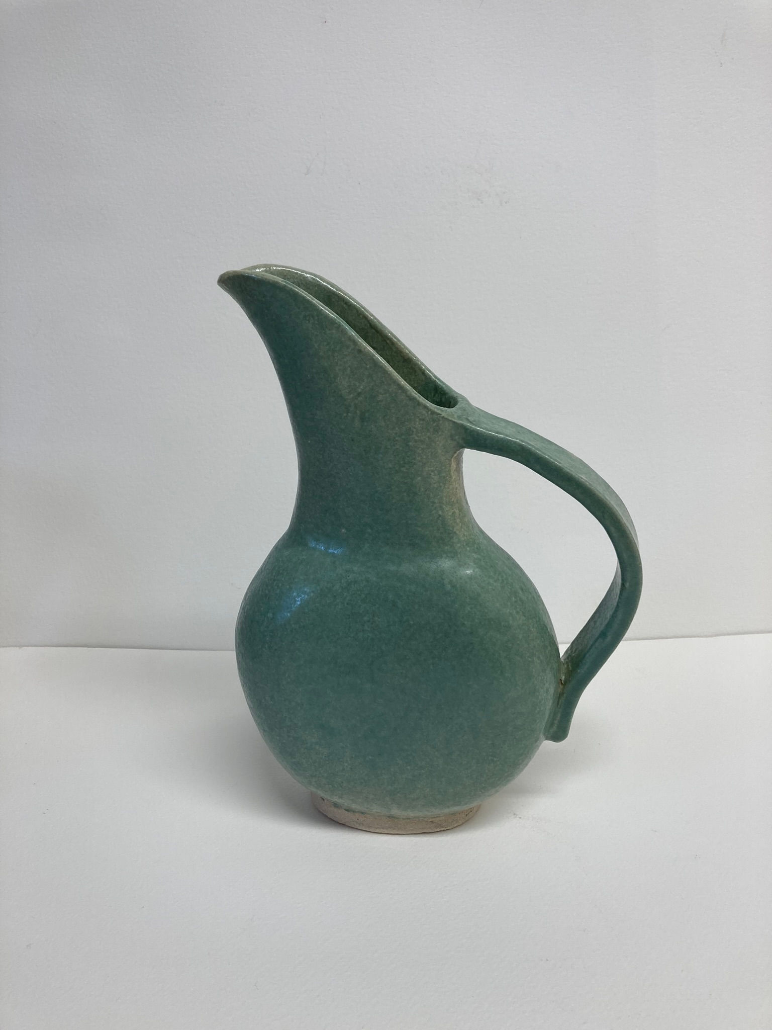 Small green jug
