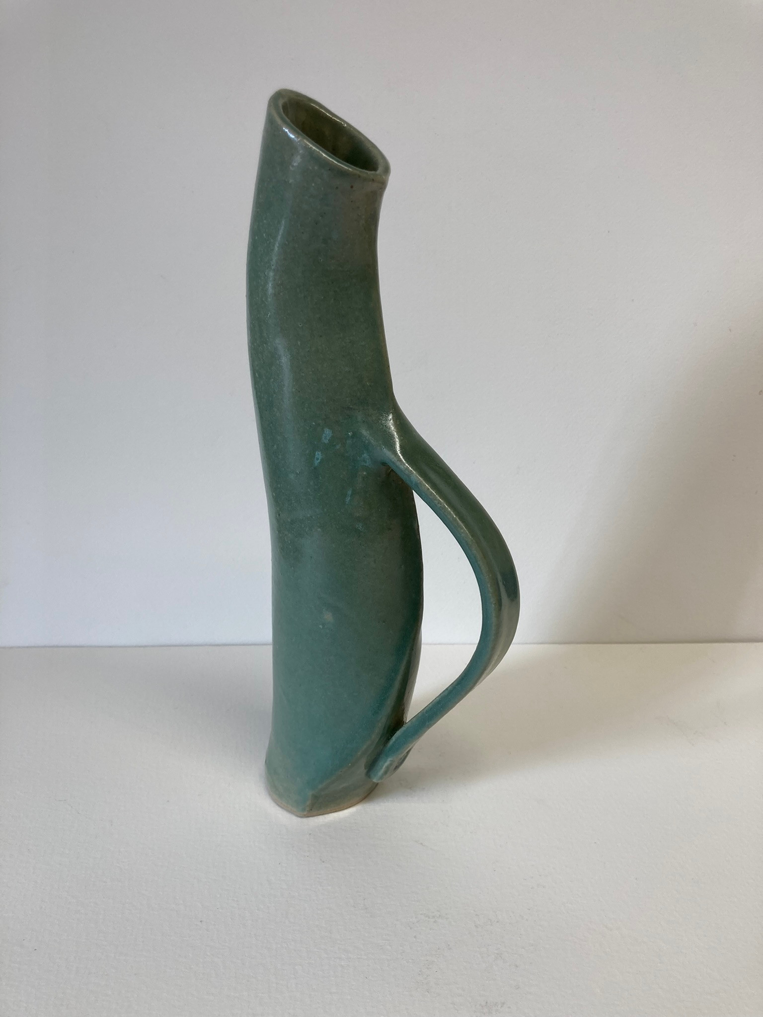 Slender green jug form