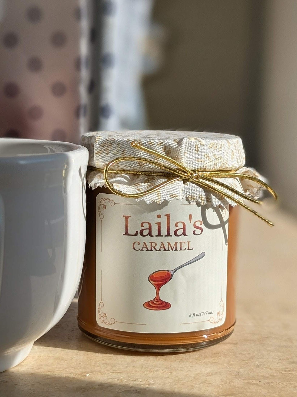 Close-up view of smooth homemade caramel in a glass jar