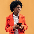 African american woman looking away with serious expression while using her mobile phone o