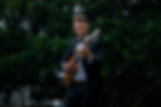 Guitarist performing live wedding music at an elegant event.