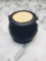 black plastic cauldron with bath bomb inside