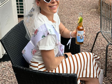 Dr Kirstyn Norman holding an alcohol-free beer during one of her hen dos after deciding she no longer identified as a drinker.