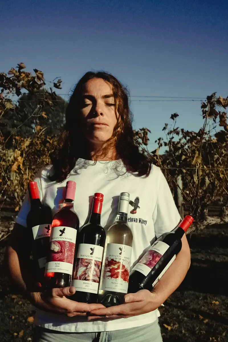 Tayla holding all of the wines at Bridgetown Winery