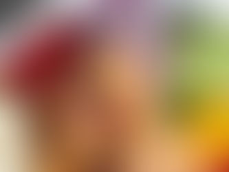 Shrimp salad bowl featuring grilled shrimp, feta, diced tomatoes, cucumbers, red onions, and yellow peppers, showcasing fresh ingredients.