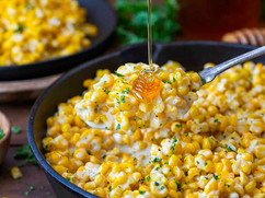 Honey butter skillet corn with sweet corn kernels coated in a creamy buttery sauce
