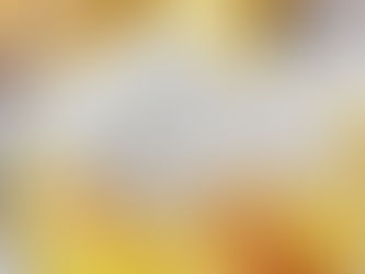 A plate of lemon dessert topped with vanilla ice cream, surrounded by lemon slices. Fork on plate, bright and inviting.