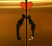 couple kissing on an elevator
