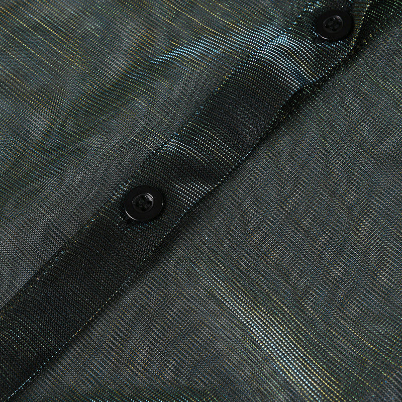 Thumbnail: Close-up of textured dark fabric with a button placket and two buttons.