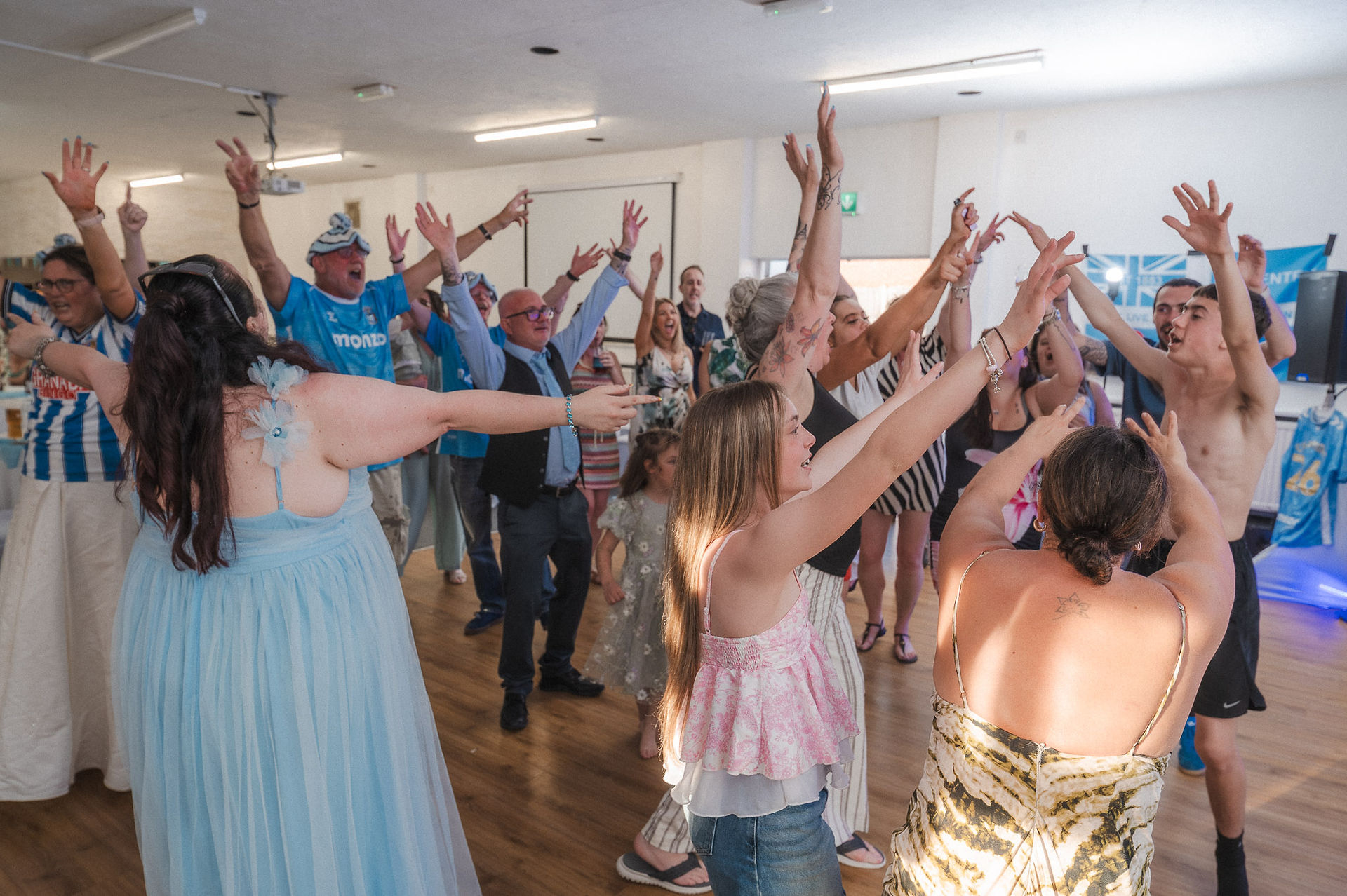 Group shot of guests dancing