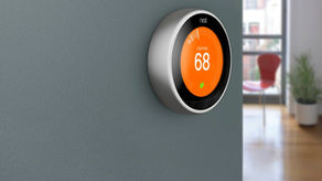 A smart thermostat on a wall