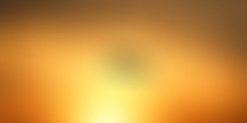 A plane in the sky during sunset