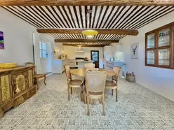 Luxury Provencal kitchen with high-quality appliances and chic designed round breakfast table.