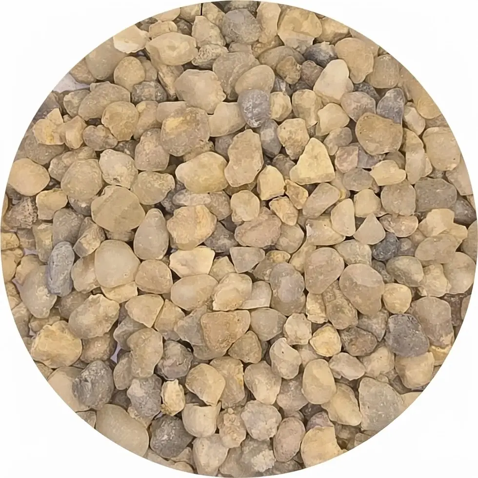Packshot photography of a large pile of small, natural-colored pebbles. The gravel displays a variety of shapes and earthy tones.