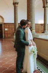 Romantic couple portraits at Copenhagen City Hall after wedding ceremony
