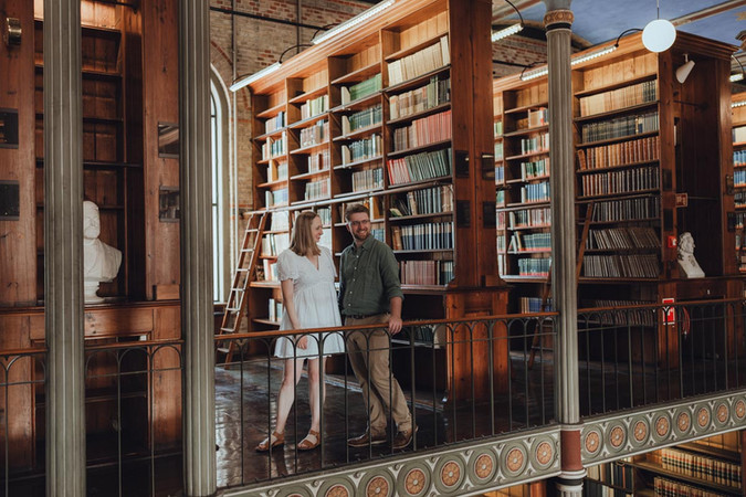Romantic portrait framed by rows of old books