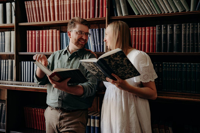 Lifestyle couple photography in atmospheric library
