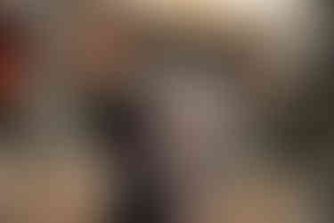 Romantic couple walking through Tivoli Gardens with Christmas decorations and snow