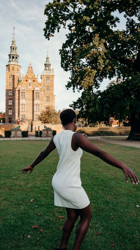 Stunning photoshoot backdrop in Copenhagen's King's Garden, with Rosenborg Castle in the distance.