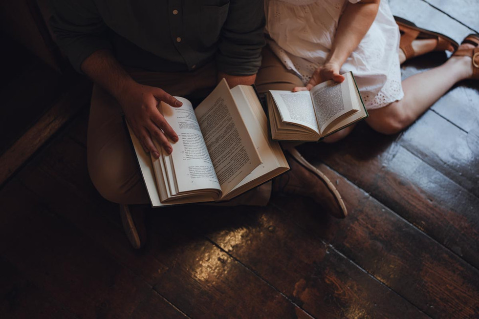 Couple sharing peaceful moment surrounded by literature