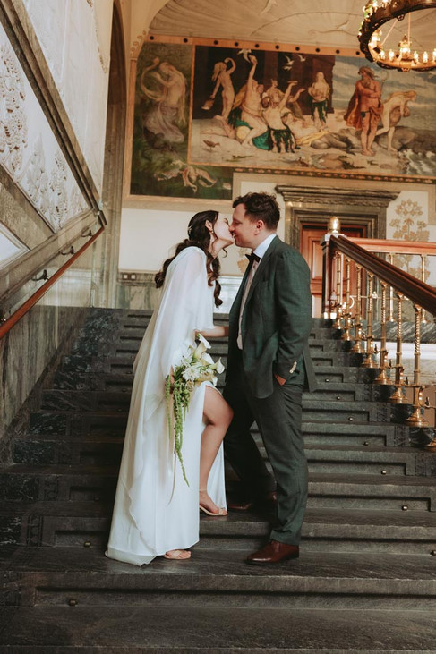 Romantic couple portraits at Copenhagen City Hall after wedding ceremony