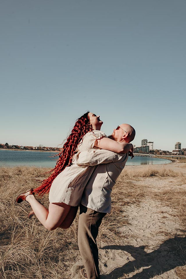 Couple sppining at the beach - candid photoshoot.