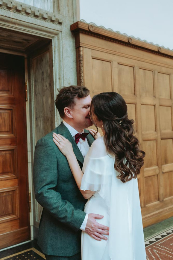 Romantic couple portraits at Copenhagen City Hall after wedding ceremony