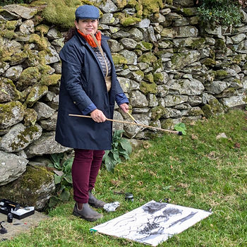 woman drawing outside