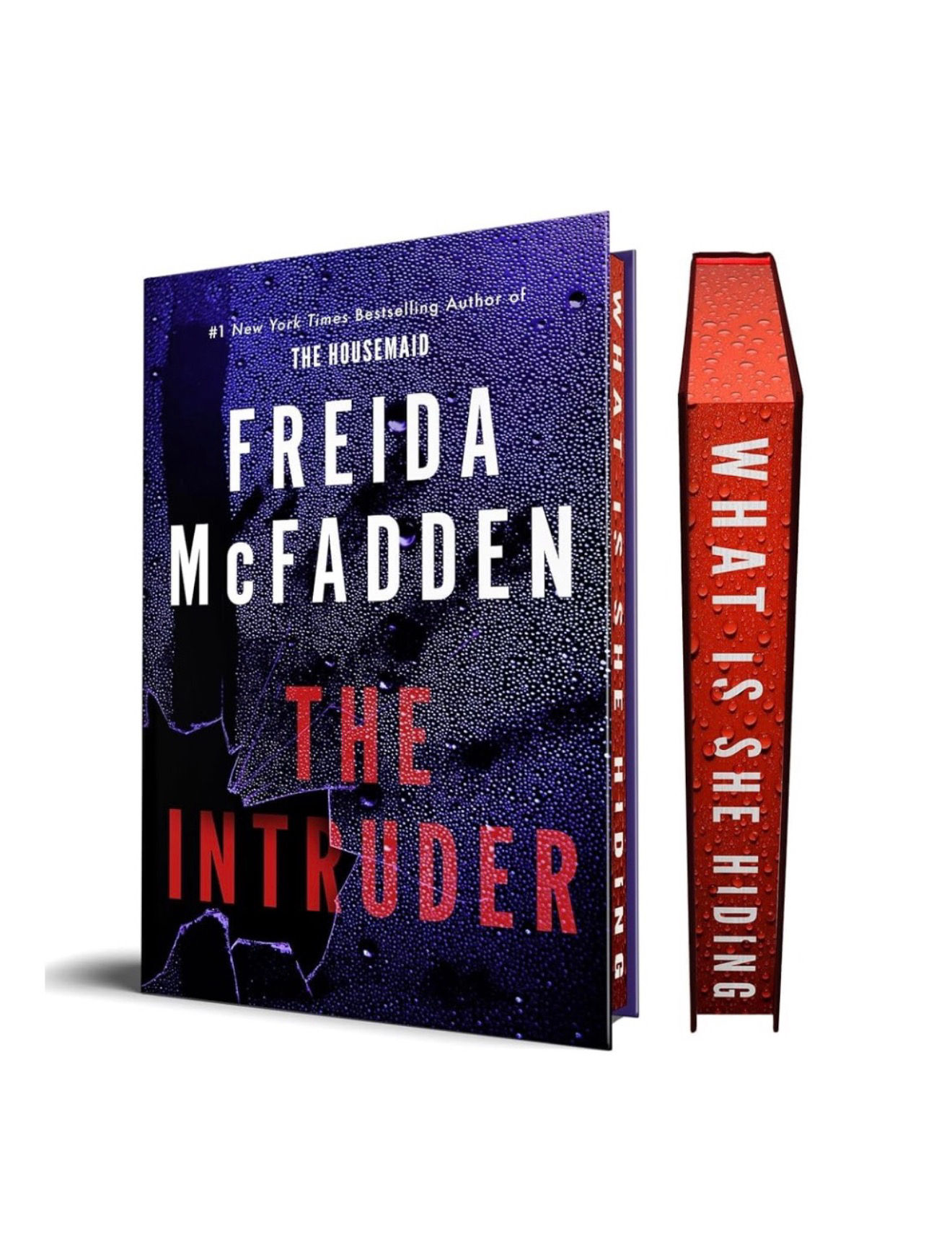 Freida McFadden's The Intruder book with spine text "What Is She Hiding"