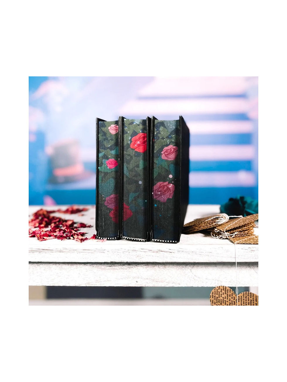 Thumbnail: Three special edition boxes, designed as books with red roses