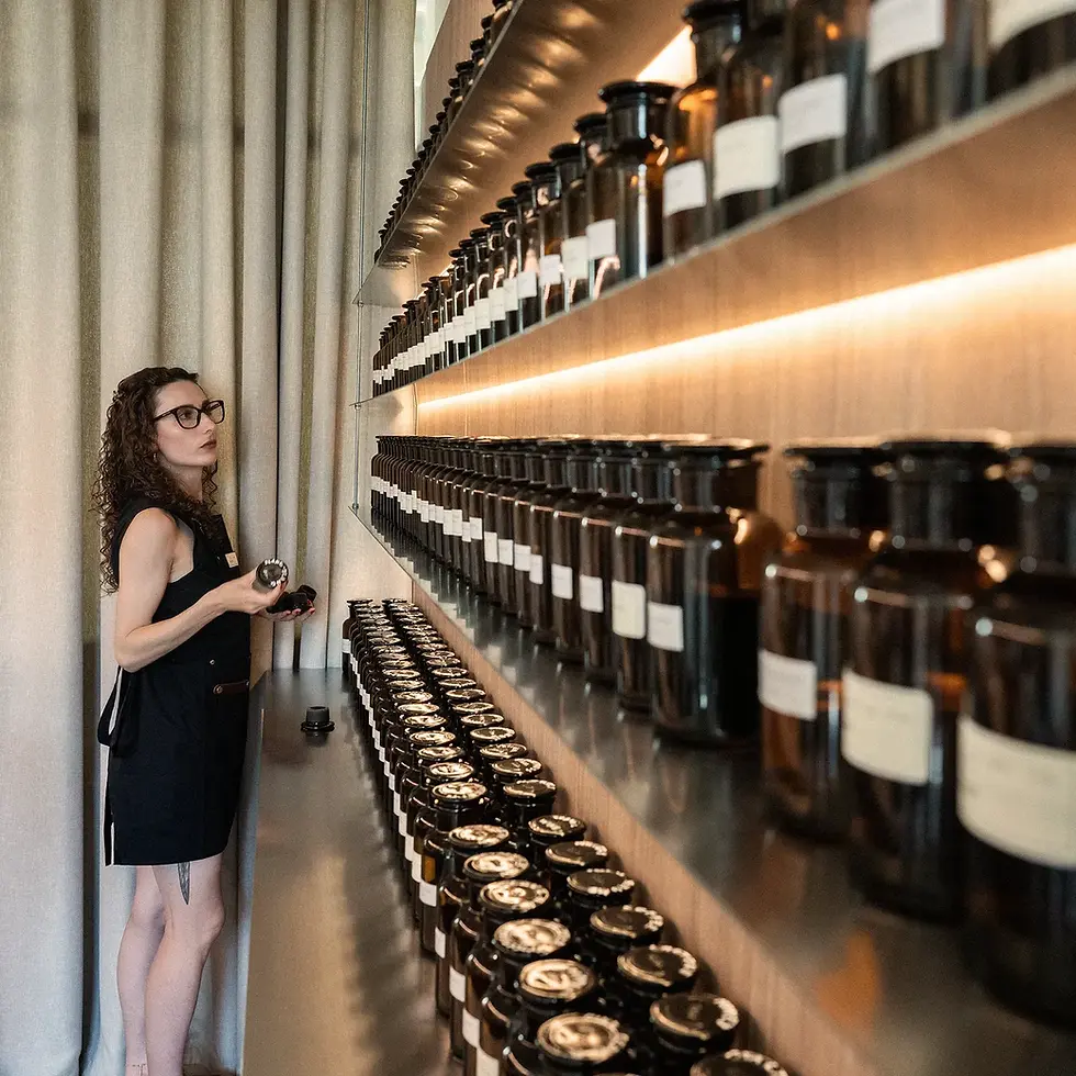 A The Elixir perfumer choosing a fragrance