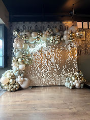 sequin wall with neon sign