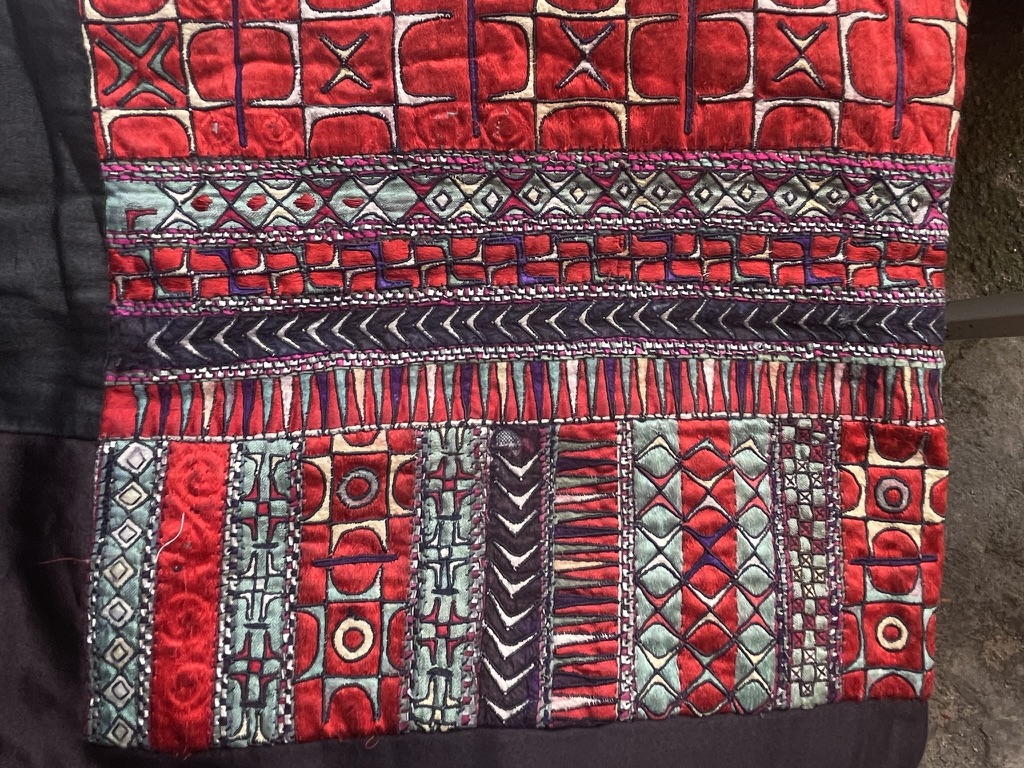 Interwoven symbols in traditional Miao embroidery · Detail