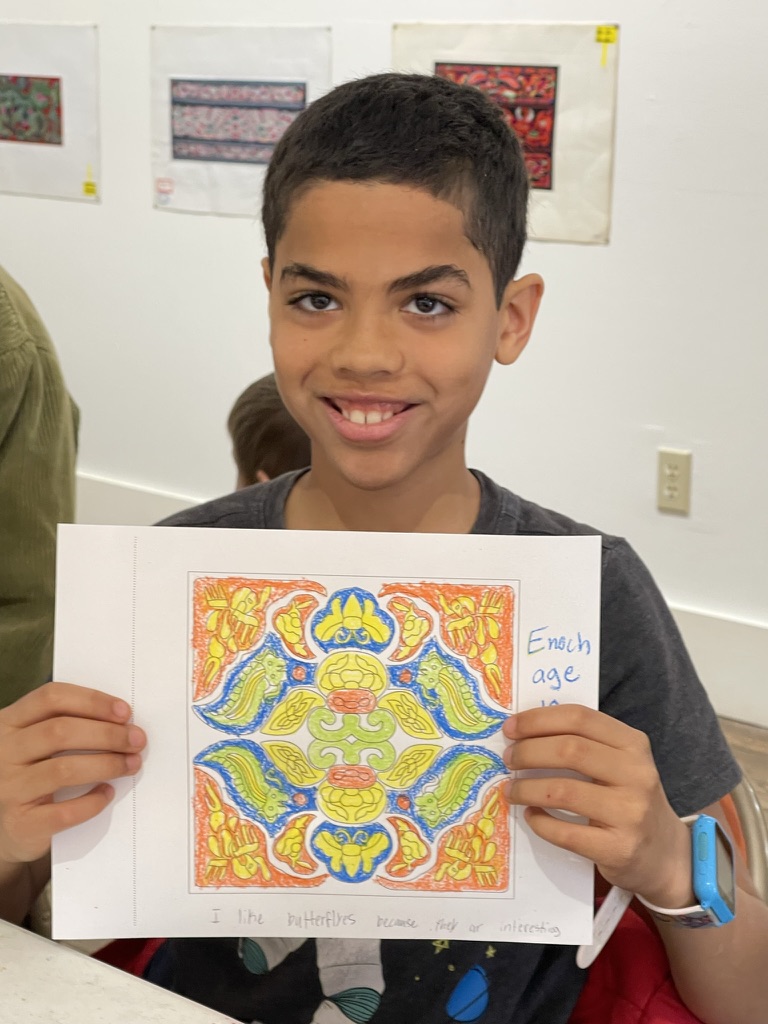 A young participant presents their work at the family workshop in Orange County, Virginia