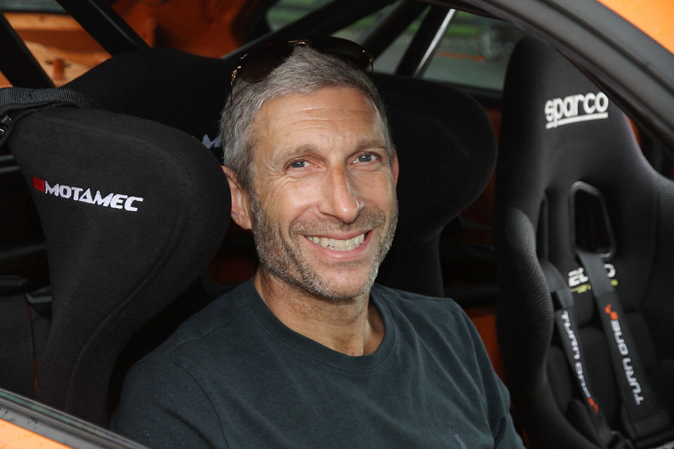 Man in race car at Dementia Support charity Goodwood Track Day