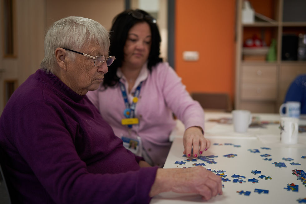 A person with dementia at Sage House doing a jigsaw puzzle