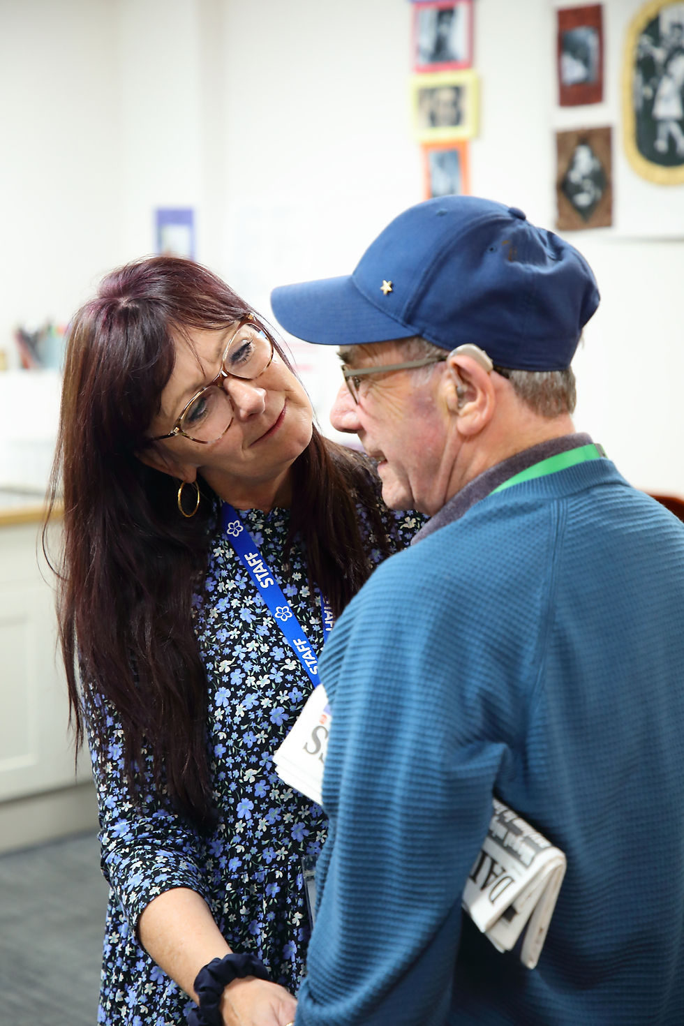 Dementia care at Day Breaks respite care at Sage House near Chichester. A woman cares for a man living with dementia.